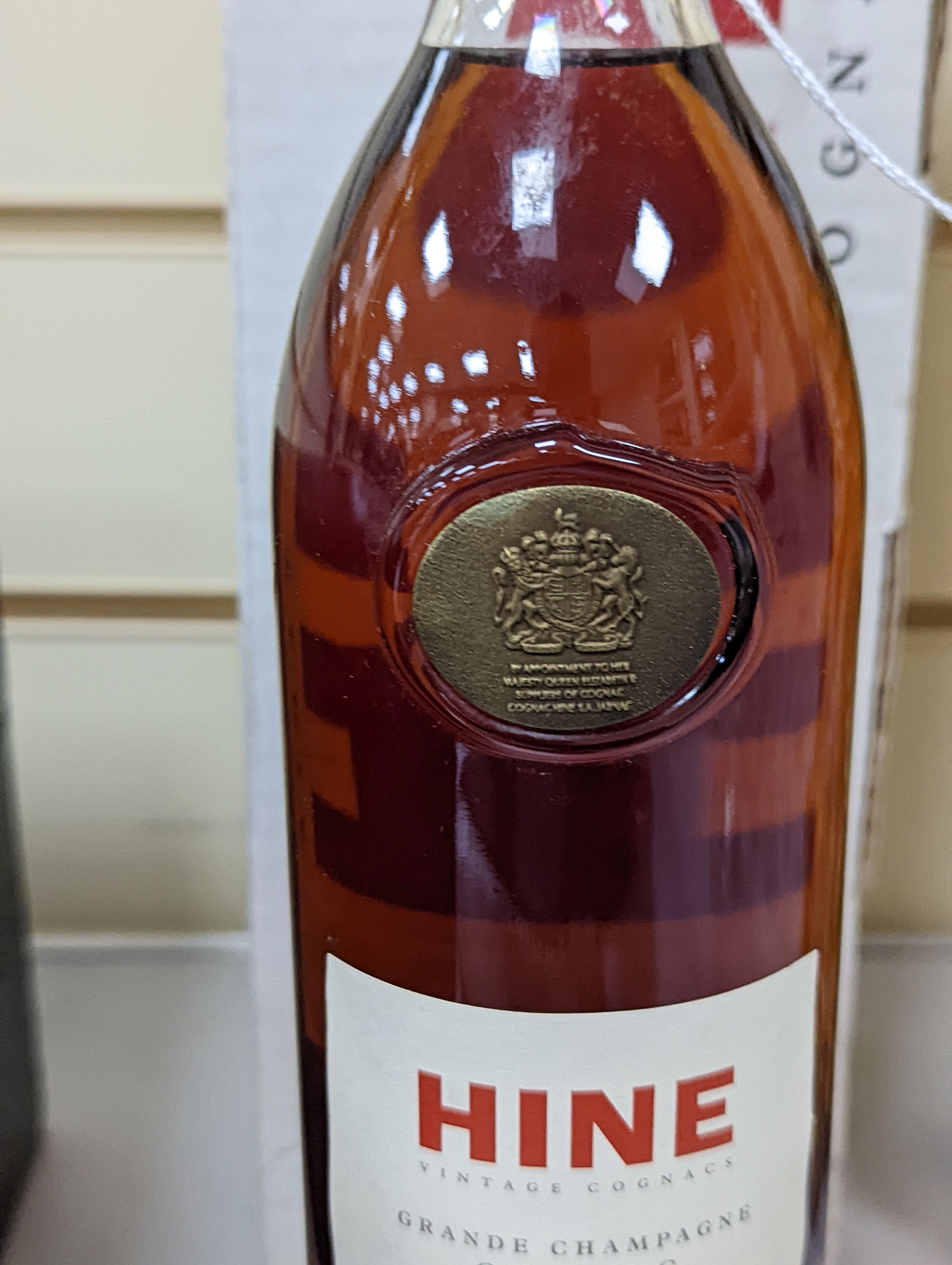 One bottle of Hine Grand Champagne Cognac, 1975. Original cardboard box.